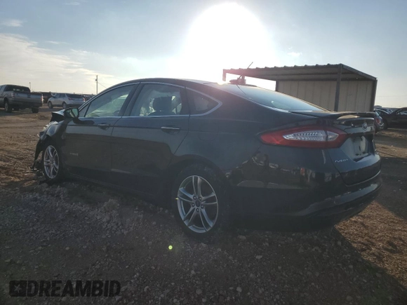 2016 Ford Fusion Titanium Hybrid with VIN 3FA6P0RU6GR356609, listed as a Copart auction lot 79803204 with 69,619 mi miles and Salvage Title. Bid and sale history available at carsss.com. Image 2.