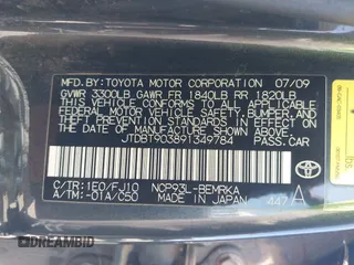 2009 Toyota Yaris with VIN JTDBT903891349784, listed as a IAAI auction lot 42135557 with 244,107 mi miles. Bid and sale history available at carsss.com. Image 9.