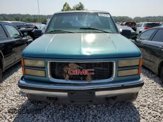 1997 GMC Sierra 2500 z VIN 1GTGK29JXVE562949, wystawiony jako Copart lot #68270174 z przebiegiem 212 422 mil mil oraz Szkody całkowita. Historia ofert i sprzedaży dostępna na DreamBid. Obrazek 5.