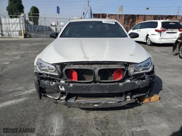 2014 BMW M5 with VIN WBSFV9C56ED097642, listed as a Copart auction lot 77905514 with 77,022 mi miles and Salvage Title. Bid and sale history available at carsss.com. Image 5.