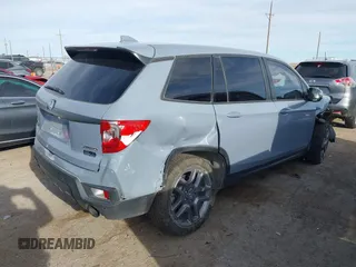 2023 Honda Passport EX-L with VIN 5FNYF8H52PB027082, listed as a IAAI auction lot 41788783 with 32,186 mi miles and . Bid and sale history available at carsss.com. Image 4.