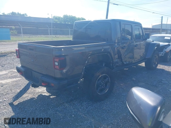 2021 Jeep Gladiator Rubicon z VIN 1C6JJTBG9ML592538, wystawiony jako IAAI lot #42206035 z przebiegiem 37 945 mil mil oraz . Historia ofert i sprzedaży dostępna na DreamBid. Obrazek 4.