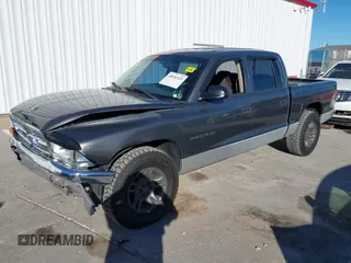 2001 Dodge Dakota Sport with VIN 1B7HL2AN21S319390, listed as a IAAI auction lot 40836729 with 118,823 mi miles. Bid and sale history available at carsss.com. Image 2.