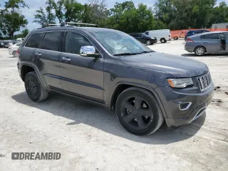 2014 Jeep Grand Cherokee Overland with VIN 1C4RJFCT7EC182234, listed as a Copart auction lot 54754465 with 185,658 mi miles and Salvage Title. Bid and sale history available at DreamBid. Image 4.