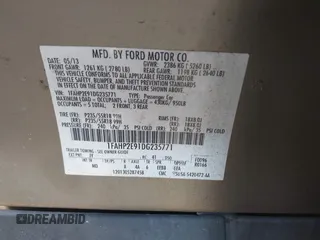 2013 Ford Taurus SEL with VIN 1FAHP2E91DG235771, listed as a IAAI auction lot 40210537 with 179,780 mi miles and . Bid and sale history available at carsss.com. Image 9.