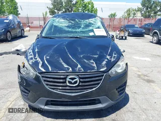 2016 Mazda CX-5 Sport with VIN JM3KE2BY4G0807776, listed as a IAAI auction lot 42206641 with 136,809 mi miles and . Bid and sale history available at DreamBid. Image 6.