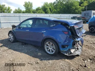 2024 Tesla Model Y Long Range with VIN 7SAYGAEEXRF983702, listed as a Copart auction lot 61536565 with Not provided miles and Salvage title. Bid and sale history available at DreamBid. Image 2.