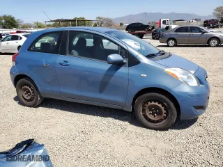 2009 Toyota Yaris with VIN JTDJT903995238147, listed as a Copart auction lot 52369925 with 124,921 mi miles and Salvage Title. Bid and sale history available at carsss.com. Image 4.