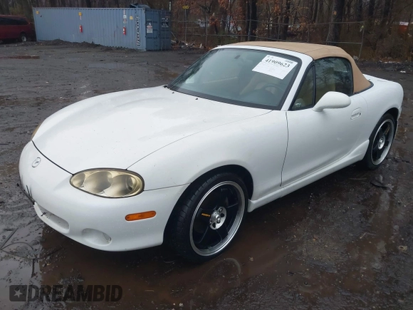 2002 Mazda MX-5 Miata Cloth z VIN JM1NB353420221527, wystawiony jako IAAI lot #41909623 z przebiegiem 90 260 mil mil oraz . Historia ofert i sprzedaży dostępna na DreamBid. Obrazek 6.