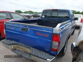 1999 Nissan Frontier XE z VIN 1N6DD26S5XC319085, wystawiony jako IAAI lot #42469039 z przebiegiem 59 251 mil mil oraz . Historia ofert i sprzedaży dostępna na DreamBid. Obrazek 4.