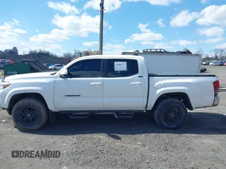 2020 Toyota Tacoma SR5 with VIN 3TMCZ5AN5LM339977, listed as a IAAI auction lot 41886937 with 94,986 mi miles and . Bid and sale history available at DreamBid. Image 14.