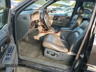 2004 GMC Envoy SLT with VIN 1GKDT13S942407244, listed as a Copart auction lot 70995064 with 162,676 mi miles and Salvage Title. Bid and sale history available at carsss.com. Image 7.