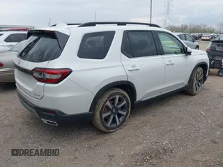 2023 Honda Pilot Elite with VIN 5FNYG1H80PB020937, listed as a IAAI auction lot 42024743 with 20,740 mi miles and . Bid and sale history available at DreamBid. Image 4.