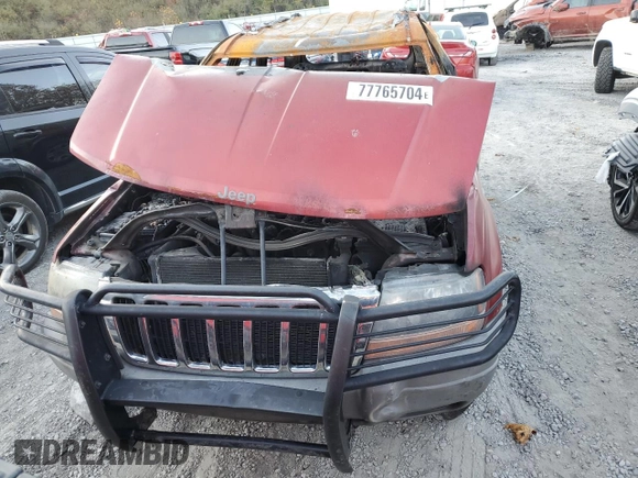 2002 Jeep Grand Cherokee z VIN 1J8GW38S72C159886, wystawiony jako Copart lot #77765704 z przebiegiem Nie podano mil oraz Szkoda całkowita • Salvage title. Historia ofert i sprzedaży dostępna na DreamBid. Obrazek 5.