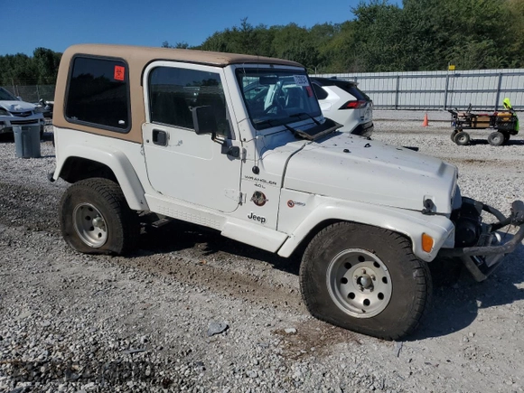 2000 Jeep Wrangler Sahara with VIN 1J4FA59SXYP764539, listed as a Copart auction lot 52707385 with 136,159 mi miles and Salvage title. Bid and sale history available at DreamBid. Image 4.