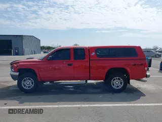 2003 Dodge Dakota z VIN 1D7HG42X93S296117, wystawiony jako IAAI lot #42045149 z przebiegiem 161 725 mil mil oraz . Historia ofert i sprzedaży dostępna na DreamBid. Obrazek 14.