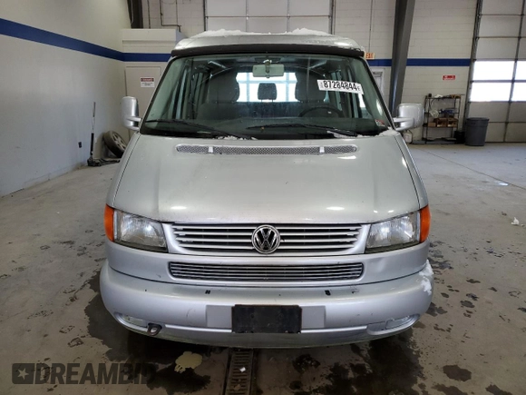 2003 Volkswagen EuroVan MV с VIN WV2NB47073H001005, выставлен на аукционе Copart как лот 87284844 с пробегом 283 979 миль миль и Чистый • Clean title. История ставок и продаж доступна на DreamBid. Изображение 5.