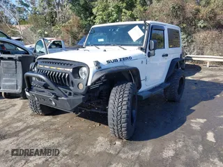 2014 Jeep Wrangler Sport with VIN 1C4AJWAG0EL245337, listed as a IAAI auction lot 41532314 with 140,721 mi miles and . Bid and sale history available at DreamBid. Image 17.