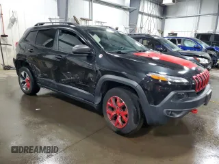2015 Jeep Cherokee Trailhawk with VIN 1C4PJMBS5FW587545, listed as a Copart auction lot 58820685 with 136,755 mi miles and Salvage title. Bid and sale history available at DreamBid. Image 4.