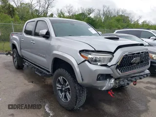 2019 Toyota Tacoma SR z VIN 3TMCZ5ANXKM224189, wystawiony jako IAAI lot #41955502 z przebiegiem 75 910 mil mil oraz . Historia ofert i sprzedaży dostępna na DreamBid. Obrazek 1.