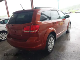 2014 Dodge Journey SE with VIN 3C4PDCAB1ET227003, listed as a IAAI auction lot 42143105 with 212,334 mi miles. Bid and sale history available at carsss.com. Image 4.