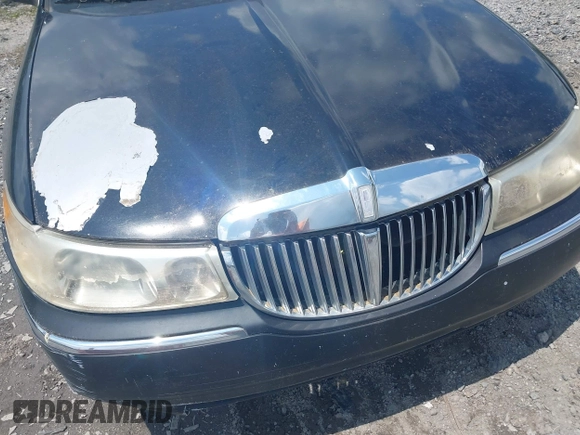 1999 Lincoln Town Car Executive z VIN 1LNHM81W9XY684966, wystawiony jako IAAI lot #42448736 z przebiegiem 175 698 mil mil oraz . Historia ofert i sprzedaży dostępna na DreamBid. Obrazek 6.