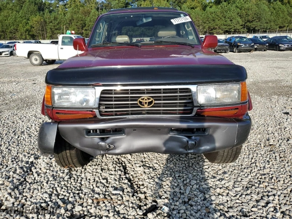 1997 Toyota Land Cruiser with VIN JT3HJ85J8V0182381, listed as a Copart auction lot 71717124 with 238,051 mi miles and Salvage Title. Bid and sale history available at carsss.com. Image 5.