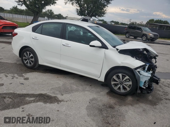 2023 Kia Rio S with VIN 3KPA24AD3PE573452, listed as a Copart auction lot 68249544 with 12,001 mi miles and Non Repairable. Bid and sale history available at DreamBid. Image 4.