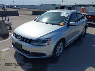 2014 Volkswagen Jetta TDI w/Premium with VIN 3VWLL7AJ6EM424935, listed as a IAAI auction lot 41533634 with 64,028 mi miles and . Bid and sale history available at DreamBid. Image 2.