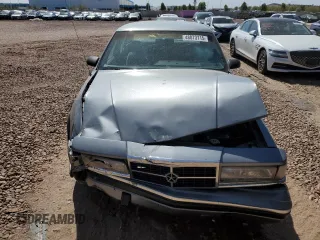 1991 Dodge Dynasty LE z VIN 1B3XC56R9MD115785, wystawiony jako Copart lot #48073715 z przebiegiem 64 483 mil mil oraz Szkoda całkowita • Salvage title. Historia ofert i sprzedaży dostępna na DreamBid. Obrazek 5.