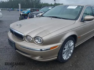 2003 Jaguar X-Type 2.5L Manual z VIN SAJEA51D53XC94089, wystawiony jako IAAI lot #42370566 z przebiegiem 81 687 mil mil oraz . Historia ofert i sprzedaży dostępna na DreamBid. Obrazek 6.