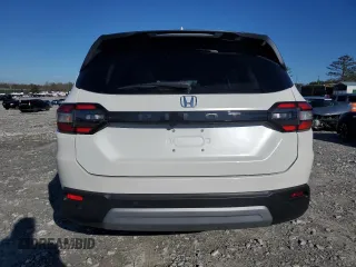 2023 Honda Pilot EX-L 8 Passenger with VIN 5FNYG2H49PB011916, listed as a Copart auction lot 87109874 with 12,461 mi miles and Salvage Title. Bid and sale history available at carsss.com. Image 6.