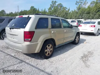 2010 Jeep Grand Cherokee Laredo with VIN 1J4PS4GK6AC136702, listed as a IAAI auction lot 42066484 with 126,509 mi miles. Bid and sale history available at carsss.com. Image 4.