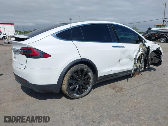 2021 Tesla Model X Long Range Plus with VIN 5YJXCBE23MF321243, listed as a IAAI auction lot 42100580 with 59,878 mi miles and . Bid and sale history available at carsss.com. Image 4.