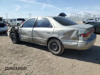 1999 Toyota Camry LE с VIN JT2BG22KXX0284593, выставлен на аукционе Copart как лот 54061685 с пробегом 229 047 миль миль и Списание • Salvage title. История ставок и продаж доступна на DreamBid. Изображение 2.