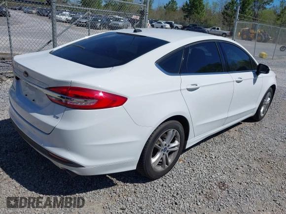 2018 Ford Fusion SE z VIN 3FA6P0H77JR142828, wystawiony jako IAAI lot #41820649 z przebiegiem 208 517 mil mil oraz . Historia ofert i sprzedaży dostępna na DreamBid. Obrazek 4.