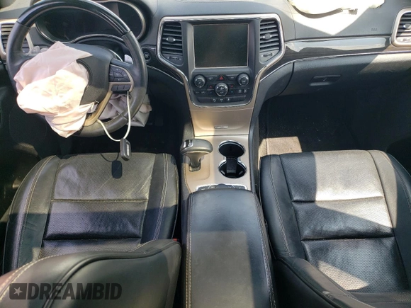 2015 Jeep Grand Cherokee Overland with VIN 1C4RJFCG6FC797653, listed as a Copart auction lot 65186695 with Not provided miles and Salvage title. Bid and sale history available at DreamBid. Image 8.