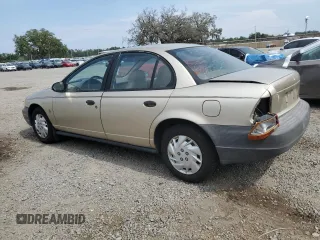 1999 Saturn SL z VIN 1G8ZH5283XZ349797, wystawiony jako Copart lot #58221955 z przebiegiem 148 506 mil mil oraz Nie do naprawy. Historia ofert i sprzedaży dostępna na DreamBid. Obrazek 2.
