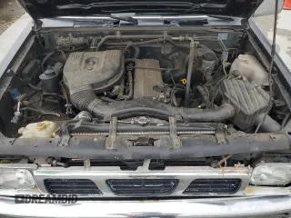 1994 Nissan Frontier XE z VIN 1N6SD16S3RC305688, wystawiony jako Copart lot #54371715 z przebiegiem 207 543 mil mil oraz Szkoda całkowita • Salvage title. Historia ofert i sprzedaży dostępna na DreamBid. Obrazek 11.