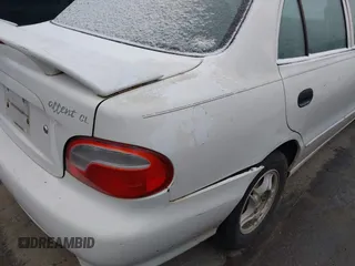 1999 Hyundai Accent z VIN KMHVF24N1XU583604, wystawiony jako IAAI lot #41613240 z przebiegiem 163 938 mil mil oraz . Historia ofert i sprzedaży dostępna na DreamBid. Obrazek 6.