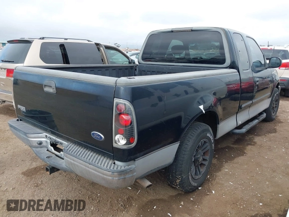 2002 Ford F-150 XL with VIN 1FTRX17W92NC06992, listed as a IAAI auction lot 41194470 with 253,923 mi miles. Bid and sale history available at carsss.com. Image 4.