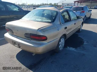 1997 Geo Prizm with VIN 1Y1SK5265VZ460271, listed as a IAAI auction lot 41185903 with 234,015 mi miles. Bid and sale history available at carsss.com. Image 4.