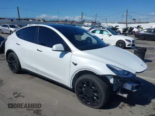 2023 Tesla Model Y Long Range with VIN 7SAYGDEEXPA129790, listed as a IAAI auction lot 41735721 with 20,402 mi miles and . Bid and sale history available at DreamBid. Image 1.
