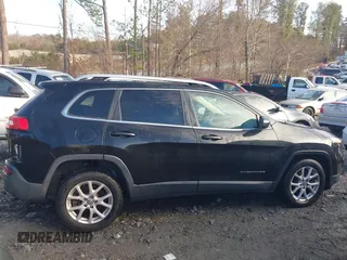 2014 Jeep Cherokee Latitude z VIN 1C4PJLCS5EW105809, wystawiony jako IAAI lot #41331585 z przebiegiem 207 609 mil mil oraz . Historia ofert i sprzedaży dostępna na DreamBid. Obrazek 13.