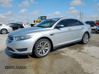 2013 Ford Taurus Limited with VIN 1FAHP2F84DG129904, listed as a Copart auction lot 58218205 with 105,877 mi miles and Salvage title. Bid and sale history available at DreamBid. Image 1.