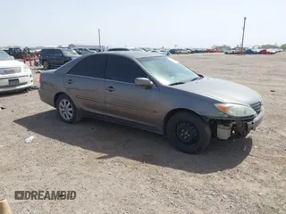 2002 Toyota Camry XLE z VIN 4T1BF30K42U512085, wystawiony jako IAAI lot #41724625 z przebiegiem 192 001 mil mil oraz . Historia ofert i sprzedaży dostępna na DreamBid. Obrazek 1.