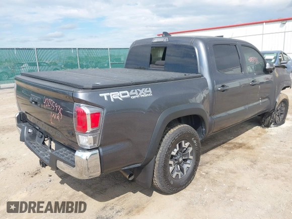 2023 Toyota Tacoma SR with VIN 3TMCZ5AN0PM636306, listed as a IAAI auction lot 42255935 with 14,131 mi miles and . Bid and sale history available at DreamBid. Image 4.