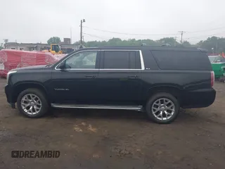 2015 GMC Yukon XL SLT z VIN 1GKS2HKC1FR146778, wystawiony jako IAAI lot #42449315 z przebiegiem 197 577 mil mil oraz . Historia ofert i sprzedaży dostępna na DreamBid. Obrazek 14.