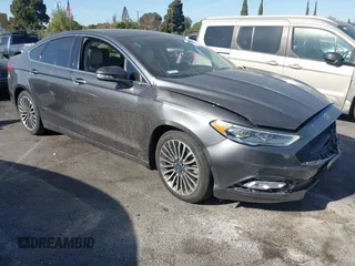 2017 Ford Fusion Titanium z VIN 3FA6P0SU5HR105477, wystawiony jako IAAI lot #41072696 z przebiegiem 92 926 mil mil oraz . Historia ofert i sprzedaży dostępna na DreamBid. Obrazek 1.