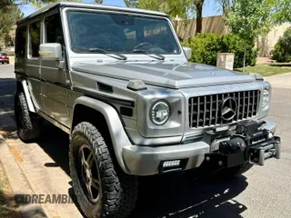 2002 Mercedes-Benz G 500 with VIN WDCYR49EX2X128555, listed as a Copart auction lot 55605995 with 225,042 mi miles and Salvage Title. Bid and sale history available at DreamBid. Image 1.